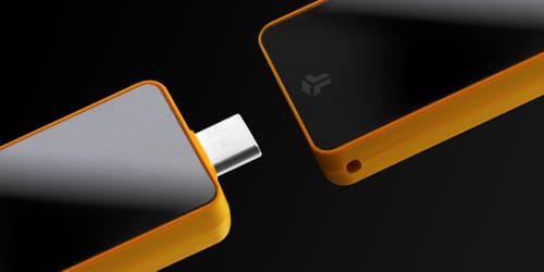 Freez Wallet hardware device in orange finish